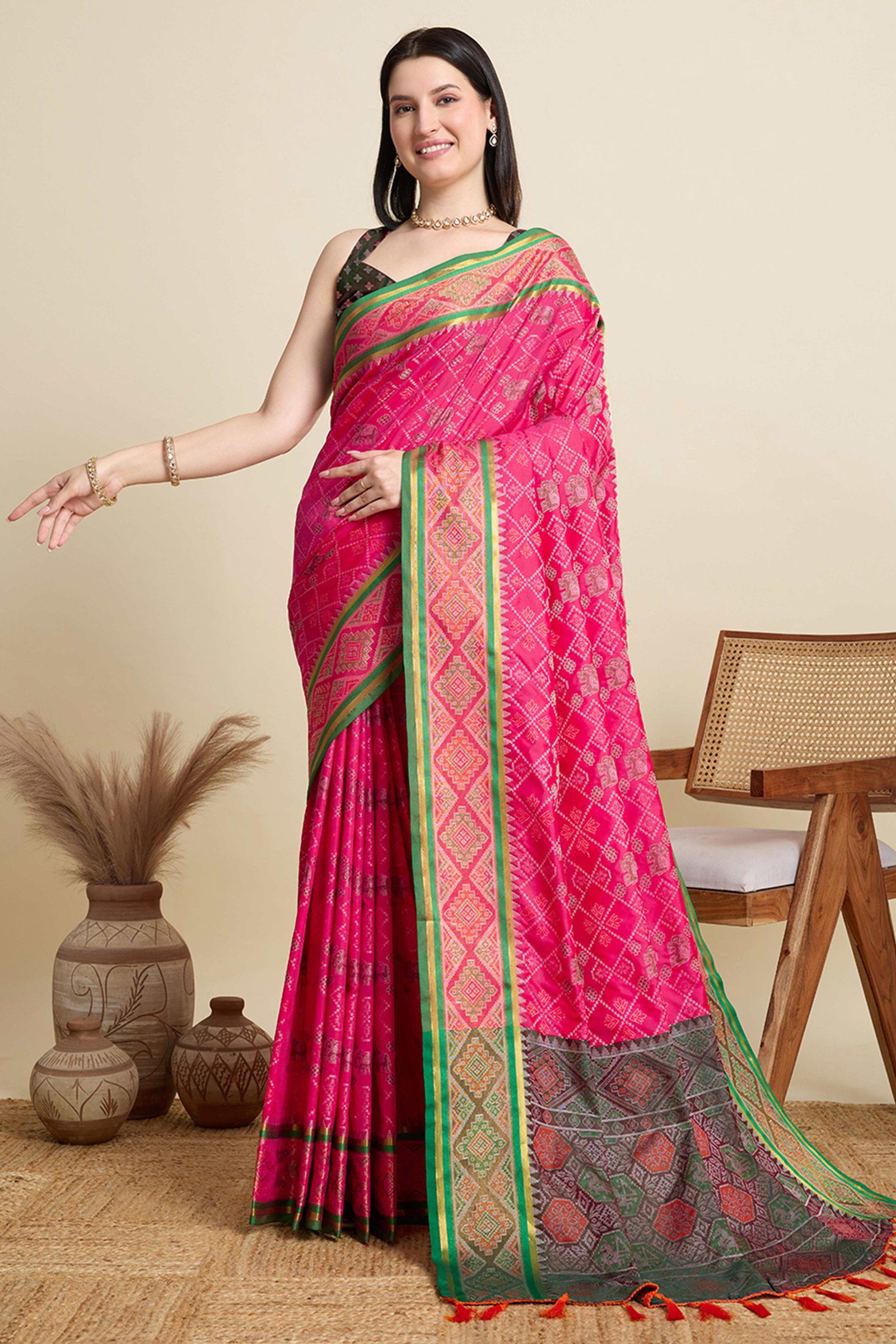 Pink Silk Blend Saree Featuring Patola Prints and a Detailed Weaving Border