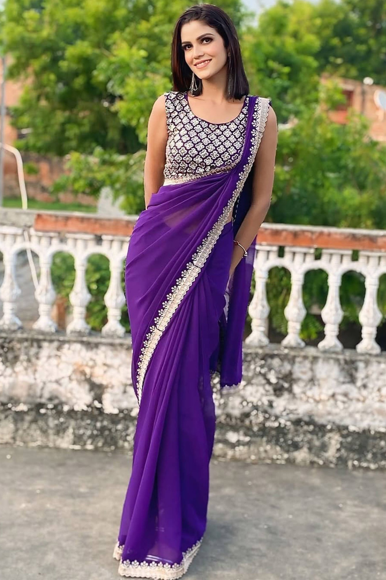 Violet Georgette Saree with Sleek Solid Finish and Embroidered Edging