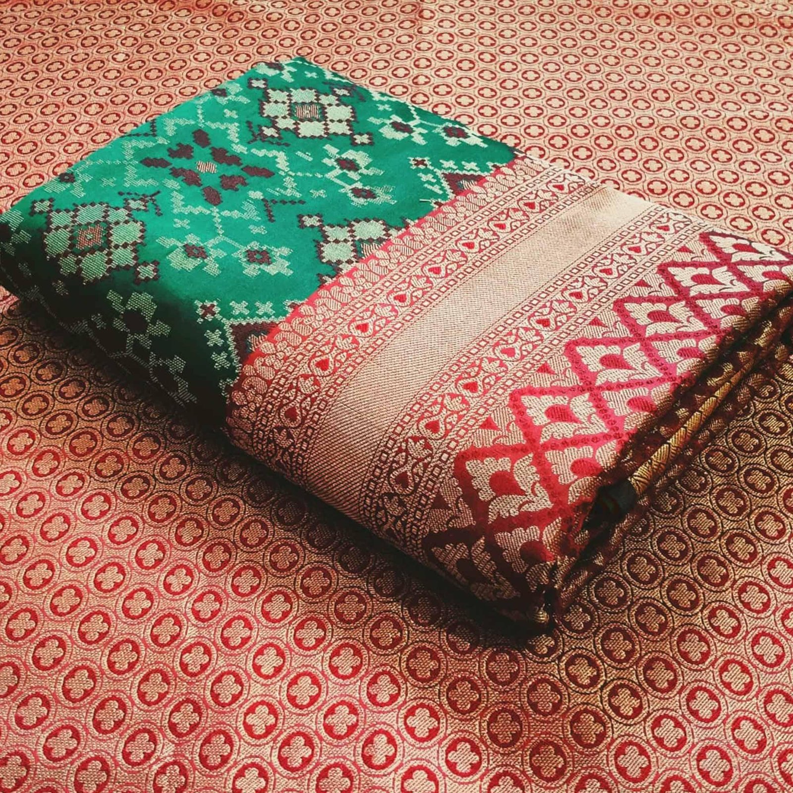 Stunning Rama Green Colored Festive Wear Woven Patola Silk Saree